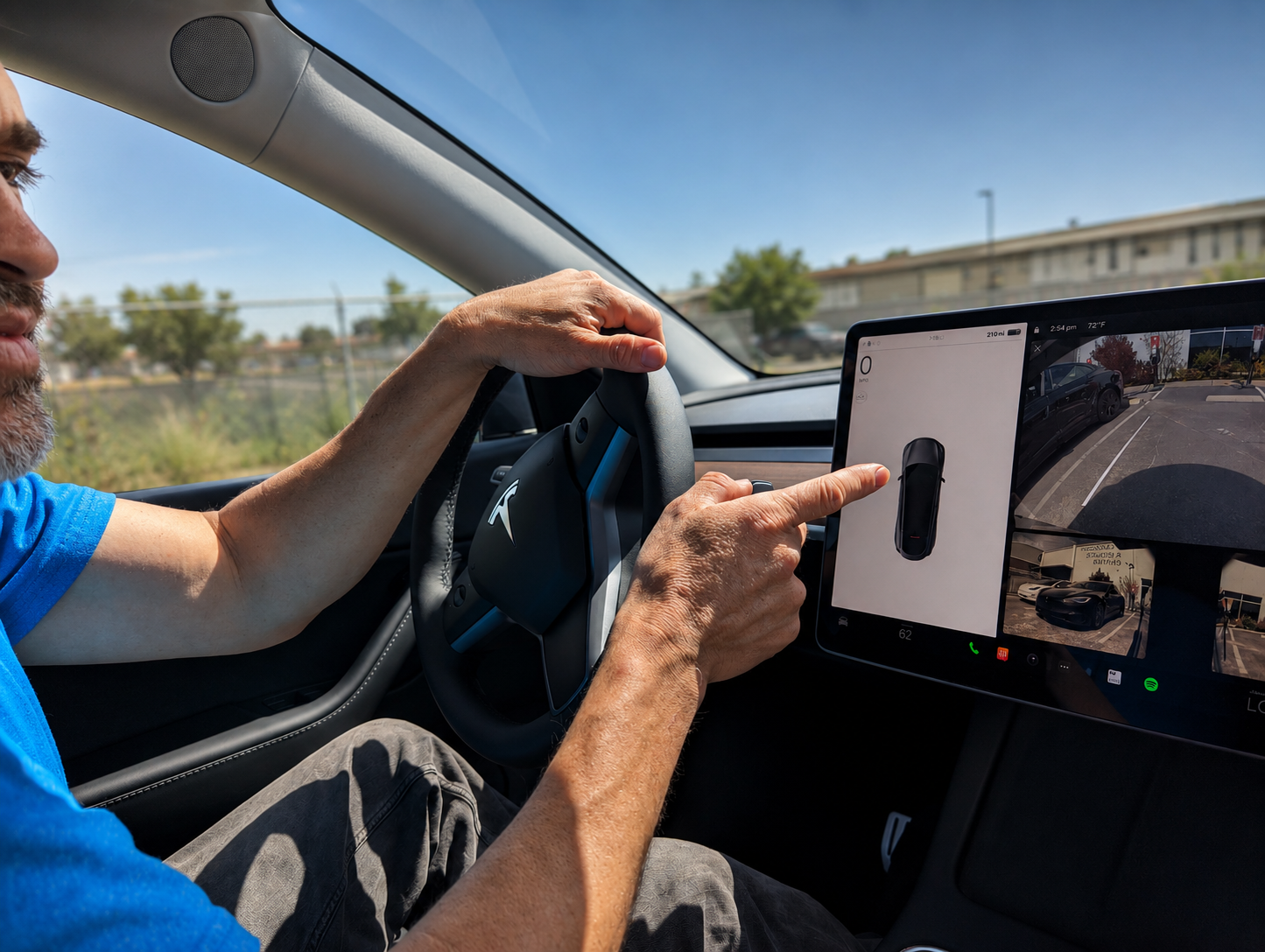Noe's brother in his first Tesla in 2022, learning to use the touchscreen